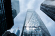 © yaqui_villegas - Skyscraper architecture tower glass skyline vertical clouds modern Bankenviertel Frankfurt financial district view with bright urban atmosphere