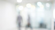 © Rahman - Blurred office hallway with people walking in the background