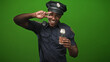 © Krakenimages.com - Police officer smiling and flashing a peace sign with his hand while holding a takeaway coffee cup and visible badge in studio; playful morning.