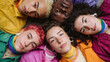 © MagicsPhotos - Diverse young people lying together colorful portrait