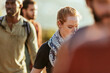 © Marko Geber - Young adults hiking on a sunny trail