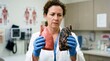 © Zampra studio's  - Female Doctor Holding Healthy and Diseased Smoker Lung Models for Respiratory Health Education