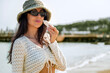 © boryanam - Beautiful Woman applying spf sunscreen on a sea background