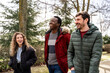 © ADDICTIVE STOCK - Group of friends having fun outdoors in winter