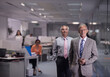 © .shock - Middle Eastern business executives in modern open office leading a professional team meeting