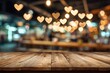 © Nurul - A warm, inviting interior scene features a rustic wooden surface in the foreground, adorned with a blurred backdrop of glowing heart-shaped lights, creating a romantic and cozy atmosphere.