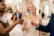 © Meow Creations - Diverse friends cheerfully toasting champagne at a festive social event