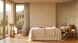 Spa room with massage table stone wall and sunset window