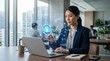 © Arip - Focused businesswoman working on laptop in office with futuristic digital cloud technology interface overlay signifying data management and connectivity in a corporate environment for global