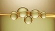 © Diana - Goldene Öl-Blasen in beige Flüssigkeit mit warmem Leuchten