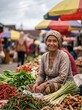 © 5 Grace Media - Smiling Indonesian woman selling fresh vegetables and spices at a traditional local market.