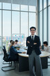 © tigercat_lpg - Portrait of confident Hispanic businessman, business CEO president, cheerful, arms crossed, and looks at camera in executive meeting with coworker team in conference office, successful investment.