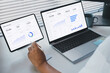 © LAONG - Remote work execution scene with professional analyzing saas data on laptop and tablet displaying business dashboard, performance metrics, and analytics charts, modern workspace productivity workflow