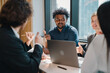 © chokniti - Business professionals discussing ideas in urban setting corporate communication teamwork consultation partnership strategy planning modern workplace collaboration