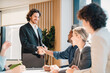 © chokniti - Business professionals handshake agreement collaboration teamwork partnership successful deal corporate meeting diverse people cooperation office trust and negotiation concept