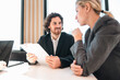 © chokniti - Business professionals discussing ideas in urban setting corporate communication teamwork consultation partnership strategy planning modern workplace collaboration