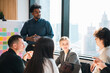 © chokniti - Business meeting office teamwork collaboration presentation planning diverse professional discussion strategy corporate conference brainstorming startup leadership manager colleague communication