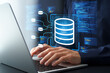 © tadamichi - Data engineering. Development of data architecture and data pipelines. Programming and source code. Engineer designing data warehouse on laptop computer.