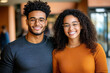 © burntime555 - Smiling young African American couple wearing glasses poses for a portrait