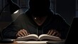 © Cio - Man in hoodie reading book late.