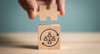 © Dudu - Employee Turnover Rate Management Concept Wooden Block Displaying Puzzle Piece and Recurring Personnel Rotation Organizational Restructuring Cycle