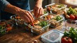 © tarik - Man hands arranging fresh healthy food into glass meal prep containers on kitchen counter close up of portion control and weekly food planning