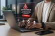 © emwe studio - Glowing red system error hologram overlay on a laptop warning user of a software crash