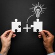 © PixelCraft Studio - Two hands holding puzzle pieces with a light bulb idea on chalkboard