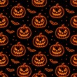 © Karat - glowing pumpkin pattern with spooky jackolantern faces and bats on a dark background in a playful seamless halloween design