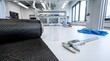 © Said Ali - Carbon fiber materials laboratory workbench with calipers and safety gear