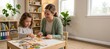 © spyrakot - Gentle pediatric therapist and child assembling simple puzzle together