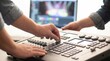 © Stitch - Technician hands adjusting sliders on a professional audio video mixing control console
