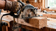 © Alan - Circular saw cutting wood plank in carpentry workshop