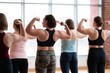 © oksa_studio - Strong women flexing biceps, demonstrating physical capability and empowerment in a diverse fitness group