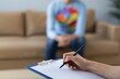 © Arfa_Media - Mental health therapy session psychologist taking notes during counseling for depression anxiety trauma or lgbtq issues. High quality photo