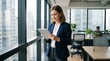 © ameliadimufah - Professional businesswoman using tablet in modern office with city skyline view