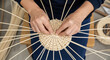 © MadeOka - Basketry Weaving Hands Crafting a Circular Rattan Pattern