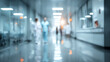© CStock - Blurred hospital corridor showcasing medical professionals engaged in patient care and healthcare activities.