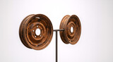Two rusty steel car wheels mounted on a metal stand. Old oxidized vintage auto rims isolated on white background. Industrial scrap art display