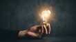 © Kristina - Hand holding glowing lightbulb with human brain inside. Concept of innovation, creative intelligence and smart idea. Intellectual discovery and mental power in business development.