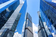 © preto_perola - View of modern glass skyscrapers in financial district. Contemporary corporate architecture symbolizing business, finance and urban development.