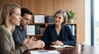 © Eve - Senior female legal advisor in dark suit listening to young couple explanation during meeting in modern office. Professional consulting and mediation concept.