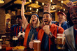 © Drazen - Passionate fans celebrating their team's victory during soccer championship.