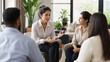 © eGGie - Employee Wellbeing Strategy, employee wellbeing strategy meeting between HR leader and employees about mental health and work life balance in a calm office wellness zone