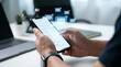 © tu - Modern digital communication concept featuring a person holding a smartphone with floating email icons, representing a mobile inbox, real-time notification, and online electronic mailing system.