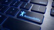 © Yassine - Bright blue accessibility icon glowing on a black computer keyboard key for modern web users