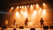 © 69 - Blurred Long Shot of Musicians Performing Live on Stage with Ambient Lighting and Soft Effects in a Concert Setting