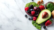 © CStock - Fresh and colorful assortment of healthy fruits, nuts, and greens on a marble surface, ideal for nutrition-focused content.
