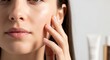 © sem.studio - A woman's serene expression as she gently touches her face, highlighting her naturally radiant and healthy complexion, emphasizing effective skincare