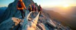 © miss irine - Group of hikers climbs steep mountain ridge using safety rope. Friends ascend rocky terrain at sunrise, enjoying adventure, teamwork during outdoor expedition. Sunrise illuminates vast landscape,